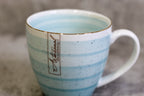 Ceramic cup with an elegant gold rim