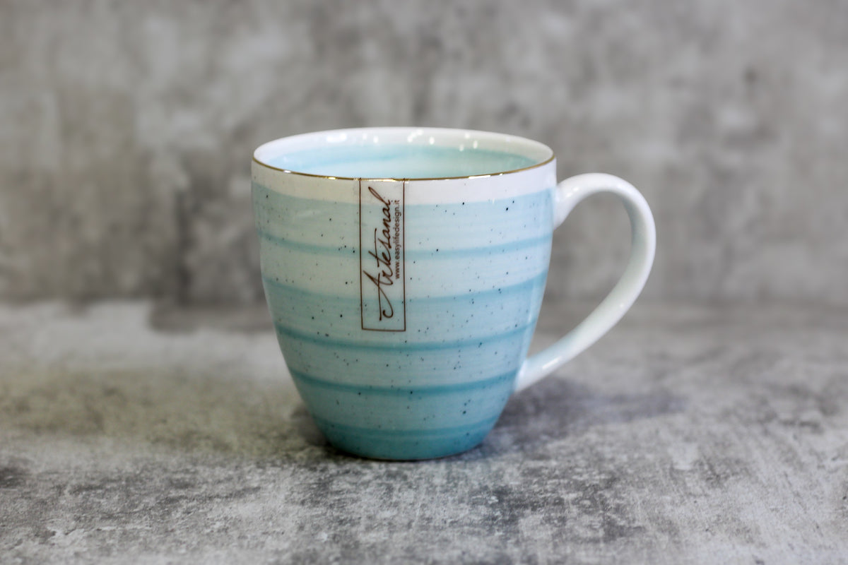 Ceramic cup with an elegant gold rim
